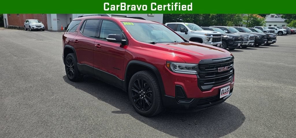 2023 GMC Acadia SLE in Volcanic Red Tintcoat — front three-quarter view