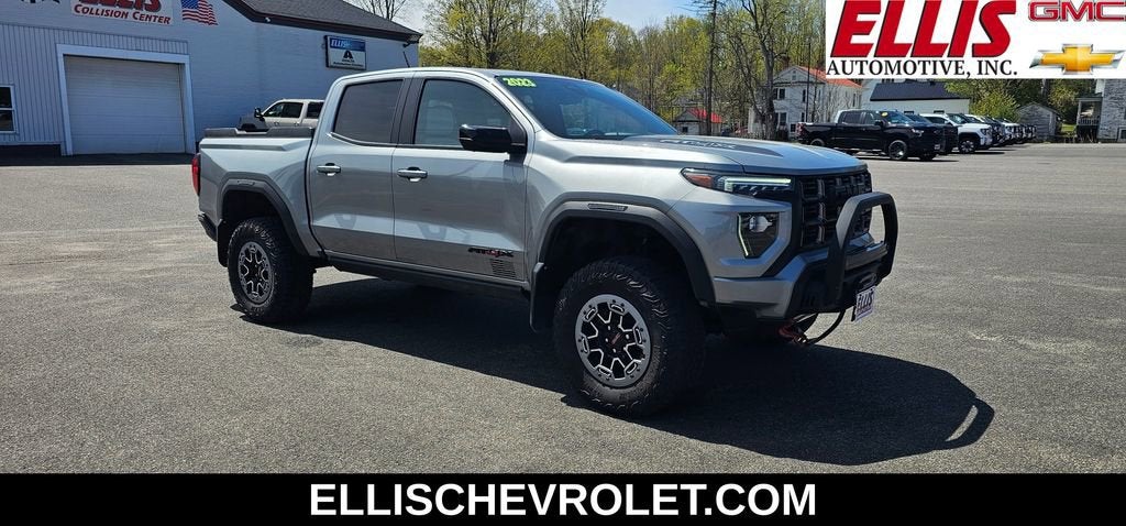 2023 GMC Canyon AT4X in Sterling Metallic — front three-quarter view