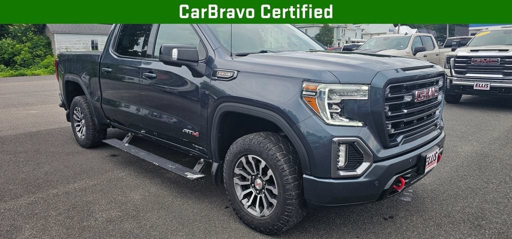 2021 GMC Sierra 1500 AT4 in Dark Sky Metallic — front three-quarter view